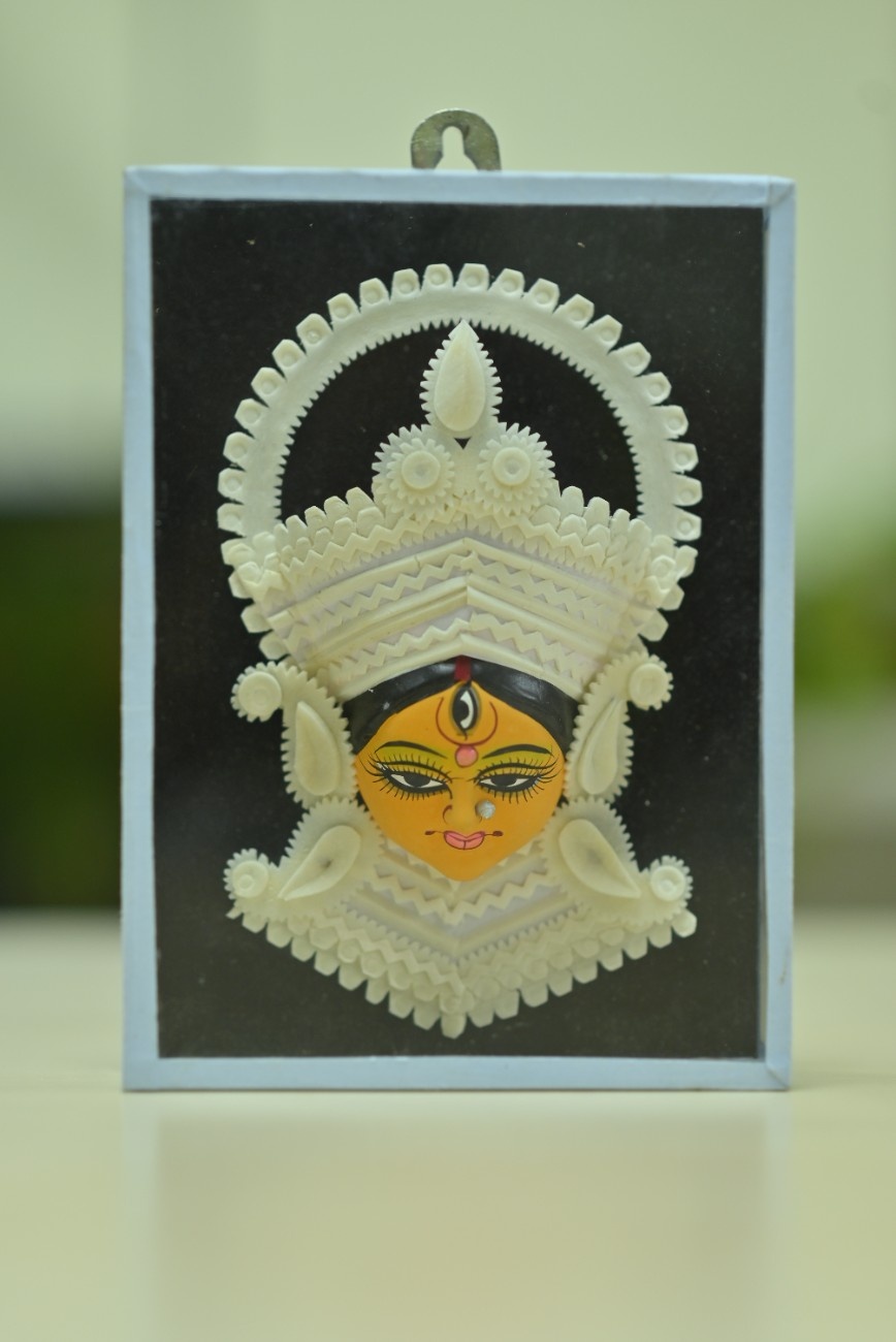 Sola showpiece of hindu idol face on hardboard with fiber casing